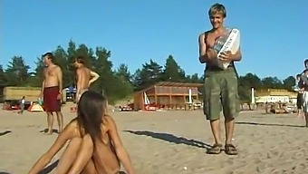 Teen Girl Sunbathes And Plays In The Nude At The Beach
