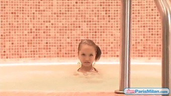 Young Paris Milan In A Swimsuit Posing Seductively In A Hot Tub