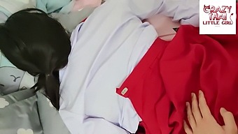 A Thai Coed In A Red Skirt Engages In Sexual Activities With Her Partner In Their Dormitory