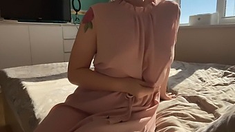 A Woman In A Pale Pink Outfit Explores Her Own Openings